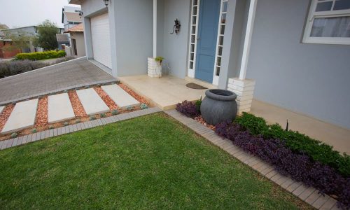 1800-x-450-x-60mm-Concrete-Slab-in-Grey-creating-a-Walkway-to-a-Entrance-door