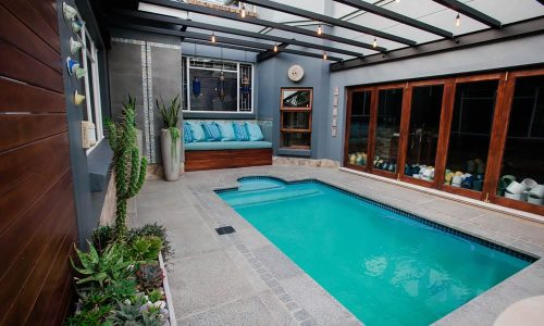 800x800mm-Polished-Grey-Concrete-Slab-used-around-a-Pool-Outdoor-Living-Space