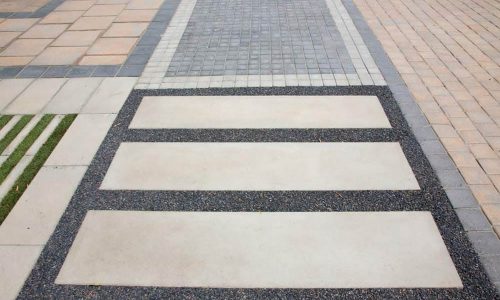 SmartStone-Slab-1800-installed-on-walkway-with-pebbles-inbetween