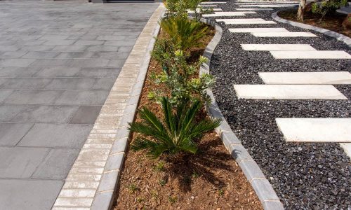 Stepping-Stones-Walkway-created-using-the-1200x300x60mm-Concrete-Slab-in-Grey